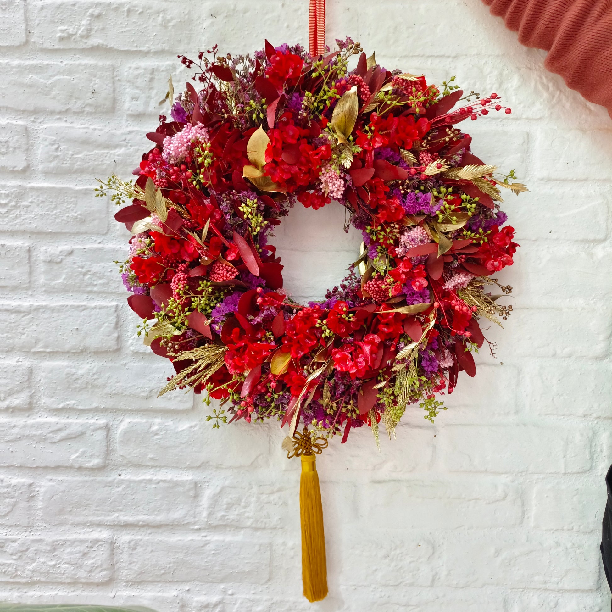 Lunar New Year Wreath, a beautiful combination of red, purple, yellow and gold flower ingredients
